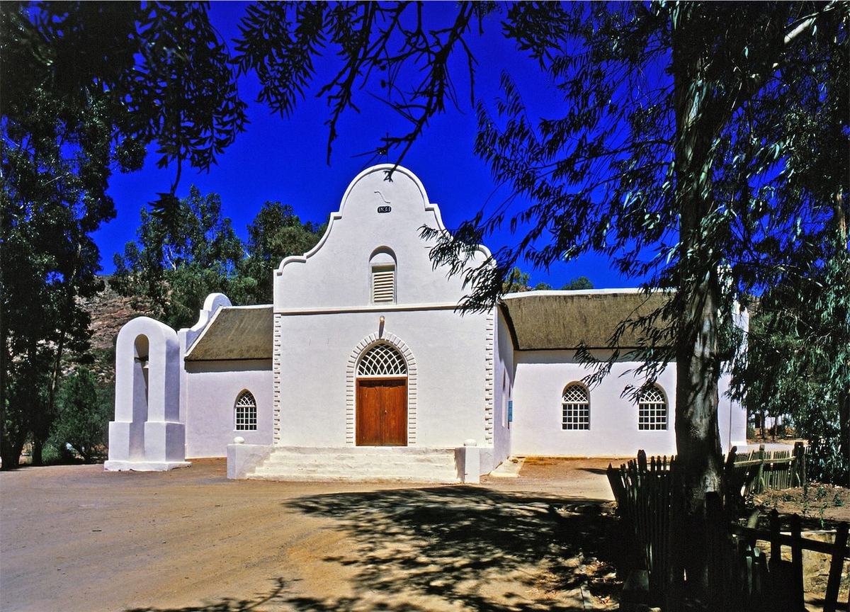 The whitewashed, gabled Moravian mission church at Wupperthal, thatched, with its bell arch